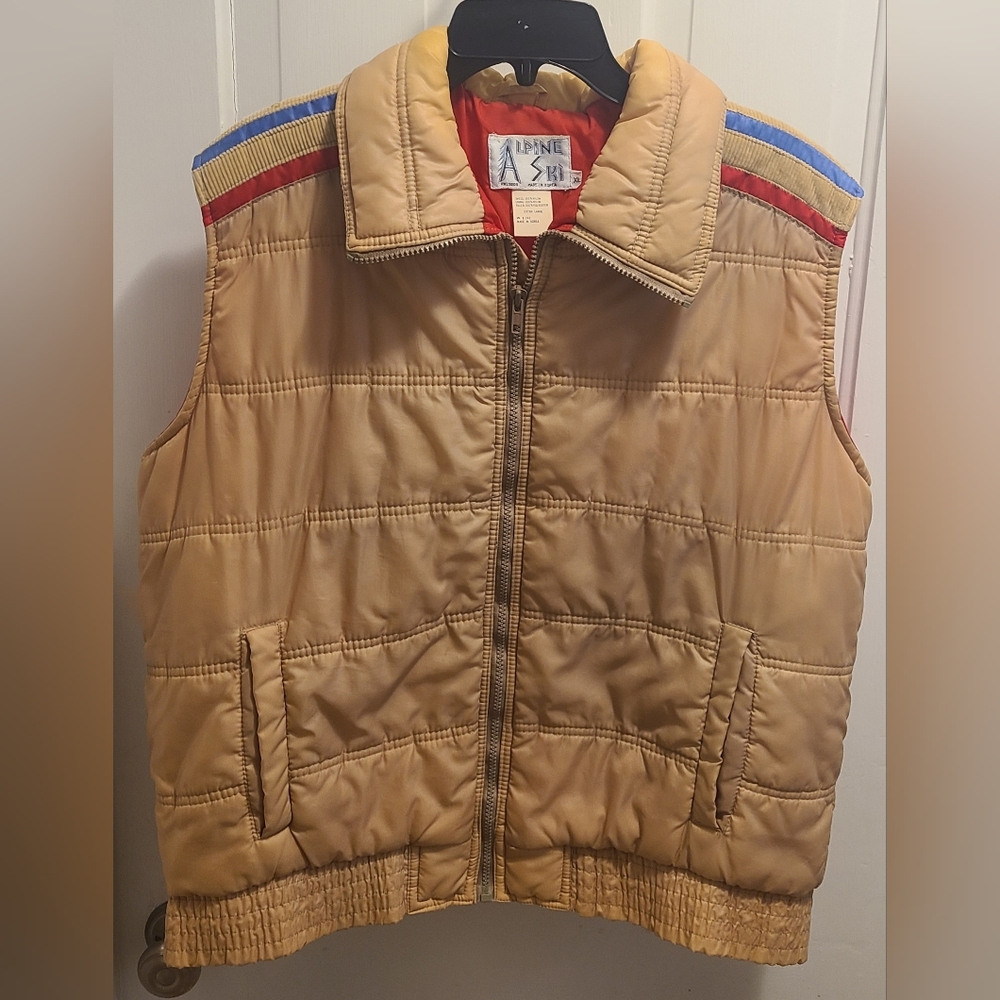Alpine Ski Tan Puffer Vest with Red and Blue Accents On Sholder